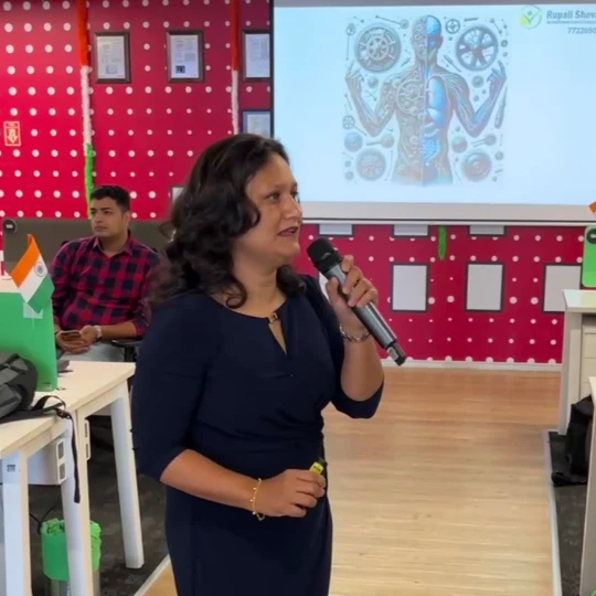 Rupali Shevade speaking at a professional health seminar in Pune