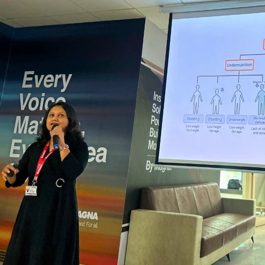 Rupali Shevade speaking at a professional health seminar in Pune
