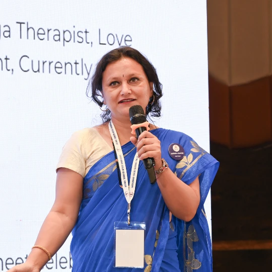 Rupali Shevade speaking at a professional health seminar in Pune