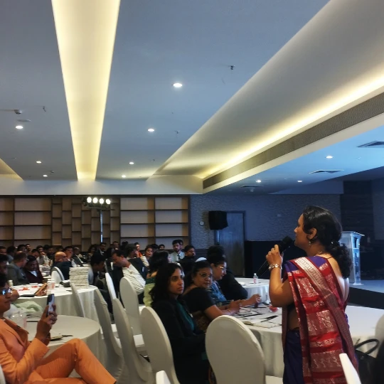 Rupali Shevade speaking at a professional health seminar in Pune